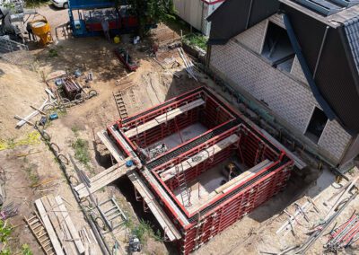 Uitbouw dubbel woonhuis met kelders